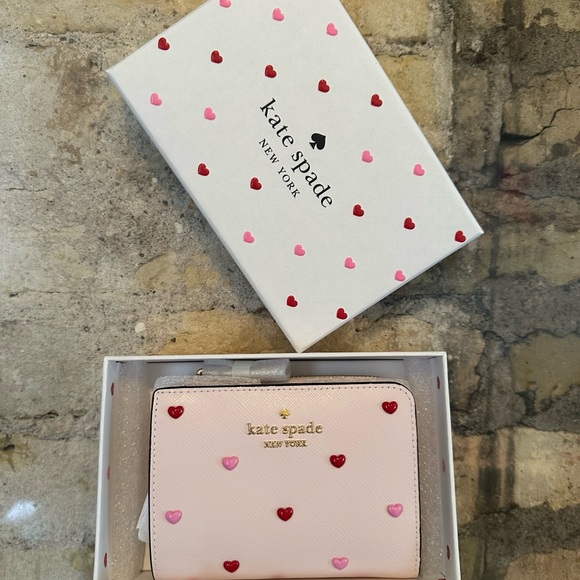 Kate Spade wallet is a light pink wallet adorned with small heart-shaped studs - Picture 16 of 16